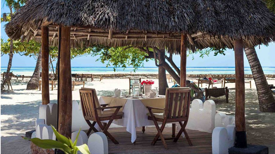 Restauranten med udsigt til strand og Det indiske Ocean